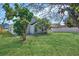 Large backyard with healthy green lawn and perimeter fence at 8630 Fort Jefferson Blvd, Orlando, FL 32822