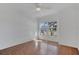 Cozy bedroom with a ceiling fan and bright natural light through the window at 8630 Fort Jefferson Blvd, Orlando, FL 32822