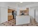 Kitchen with stainless steel appliances and a view into the large living room at 8630 Fort Jefferson Blvd, Orlando, FL 32822