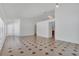 Open-concept living room with decorative tile flooring and neutral paint at 8630 Fort Jefferson Blvd, Orlando, FL 32822