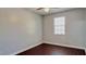 Bright bedroom with hardwood floors and fresh, neutral paint at 8854 Oak Landings Ct, Orlando, FL 32836