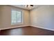 Bright bedroom with hardwood flooring and a large window at 8854 Oak Landings Ct, Orlando, FL 32836