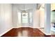 Bright dining area featuring hardwood floors and a modern chandelier at 8854 Oak Landings Ct, Orlando, FL 32836