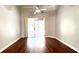 Bright living room with hardwood floors and a view of the pool at 8854 Oak Landings Ct, Orlando, FL 32836