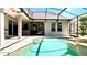 Covered patio offers seamless access to the pool, creating an ideal space for outdoor entertaining at 8854 Oak Landings Ct, Orlando, FL 32836