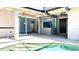 Poolside patio provides outdoor living space with views into the home's interior, ideal for entertaining at 8854 Oak Landings Ct, Orlando, FL 32836