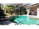 Sparkling pool with stone accents within screened enclosure, creating a serene outdoor oasis at 8854 Oak Landings Ct, Orlando, FL 32836