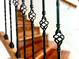 Close-up of the staircase railing with ornate wrought iron detailing at 8854 Oak Landings Ct, Orlando, FL 32836