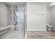Bathroom features a glass shower with a seat, neutral walls and wood-style flooring at 8908 Turnberry Ct, Orlando, FL 32819