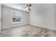 Bright, clean bedroom with a ceiling fan and large window at 8908 Turnberry Ct, Orlando, FL 32819