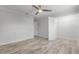 Bedroom features modern closet, wood-look floors, a ceiling fan, and a neutral color palette at 8908 Turnberry Ct, Orlando, FL 32819