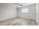 This bedroom has stylish wood-look floors, baseboard, recessed lighting, and a ceiling fan at 8908 Turnberry Ct, Orlando, FL 32819