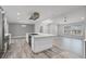 Modern kitchen with stainless steel appliances and a large island with gas cooktop at 8908 Turnberry Ct, Orlando, FL 32819