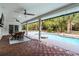 A covered outdoor patio with views of the pool area at 8908 Turnberry Ct, Orlando, FL 32819