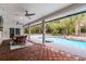 A covered outdoor patio with views of the pool area at 8908 Turnberry Ct, Orlando, FL 32819