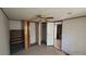 Bedroom with closet, ceiling fan and ensuite bathroom, ready for updates and personal touches at 20144 Se 156Th St, Umatilla, FL 32784