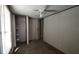 Bedroom with closet, ceiling fan, and ample light, ready to be renovated at 20144 Se 156Th St, Umatilla, FL 32784