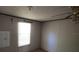 Bright bedroom with natural light, has ceiling fan, ideal for upgrades and personalization at 20144 Se 156Th St, Umatilla, FL 32784