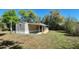 Exterior view of a single-story home featuring a ramp leading up to the front entrance at 20144 Se 156Th St, Umatilla, FL 32784