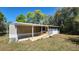 Exterior view of a single-story home with a ramp leading up to the front entrance at 20144 Se 156Th St, Umatilla, FL 32784