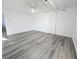 Finished basement with modern ceiling fan and sleek gray flooring at 11618 Churchill St, Orlando, FL 32817