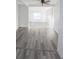 Bright living room featuring sleek gray flooring and modern ceiling fan at 11618 Churchill St, Orlando, FL 32817