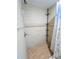 An updated tiled shower with a rainfall showerhead and built-in shelves at 11618 Churchill St, Orlando, FL 32817