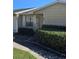 Charming home exterior with well-manicured shrubs and front lawn at 1168 Woodman Way, Orlando, FL 32818