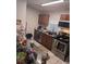 Kitchen with stainless steel appliances, wood cabinets and granite counters at 1168 Woodman Way, Orlando, FL 32818