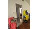View of the entry way, with a glimpse into the living room with warm wood floors at 1168 Woodman Way, Orlando, FL 32818