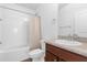 Well-lit bathroom with a shower-tub combination and sleek fixtures at 1200 Kellogg Dr, Tavares, FL 32778