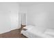 Clean bedroom showing wood floors, neutral walls and natural light from an exterior window at 1200 Kellogg Dr, Tavares, FL 32778