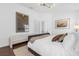 Bedroom featuring modern furniture, an open doorway, and neutral colors creating a peaceful atmosphere at 1200 Kellogg Dr, Tavares, FL 32778