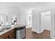 Kitchen area featuring a dishwasher, view into the bedrooms and other living areas at 1200 Kellogg Dr, Tavares, FL 32778