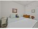 Cozy bedroom featuring a comfortable bed and a whimsical lion doll at 1206 Bella Cara Ct, Davenport, FL 33896