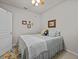 Inviting bedroom with floral accents, a comfortable bed, and a cozy atmosphere perfect for relaxation at 1206 Bella Cara Ct, Davenport, FL 33896