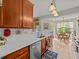 Modern kitchen with granite countertops, stainless steel appliances, and a view of the dining area at 1206 Bella Cara Ct, Davenport, FL 33896