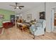 Spacious living room featuring hard wood floors and comfortable seating arrangements at 1206 Bella Cara Ct, Davenport, FL 33896