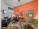 Comfortable home office featuring a large window, desk, and cozy armchair at 1206 Bella Cara Ct, Davenport, FL 33896
