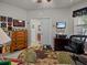 Home office showcasing neutral walls, window, and furnishings at 1206 Bella Cara Ct, Davenport, FL 33896