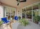 Comfortable outdoor seating area with potted plants and views of the interior at 1206 Bella Cara Ct, Davenport, FL 33896