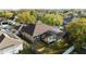 Backyard aerial view of a single Gathering home, with screened in porch and pool at 13711 Dornoch Dr, Orlando, FL 32828