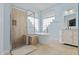 Elegant bathroom featuring a soaking tub, glass-enclosed shower, and vanity at 13711 Dornoch Dr, Orlando, FL 32828