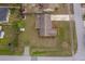 Home with the backyard storage sheds, mature trees, screened patio, landscaping, and driveway at 147 13Th Ave, Longwood, FL 32750