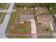 Aerial view of the home showcasing the lot size, landscaping, driveway and backyard storage sheds at 147 13Th Ave, Longwood, FL 32750