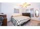 Comfortable bedroom with a ceiling fan, neutral walls, and a large dresser for ample storage at 147 13Th Ave, Longwood, FL 32750