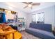 Functional bedroom featuring a futon, storage shelving, closet and a window for natural light at 147 13Th Ave, Longwood, FL 32750