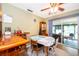 Inviting dining room features a bar area and sliding glass doors to the screened-in lanai at 147 13Th Ave, Longwood, FL 32750