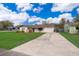 Charming single-story home features a manicured lawn, driveway, and inviting front entry at 147 13Th Ave, Longwood, FL 32750