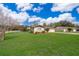 Charming single-story home features a manicured lawn and inviting front entry at 147 13Th Ave, Longwood, FL 32750